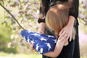Image of young girl holding American flag